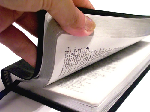 hand opening bible