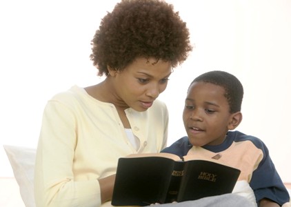 mom reading to son